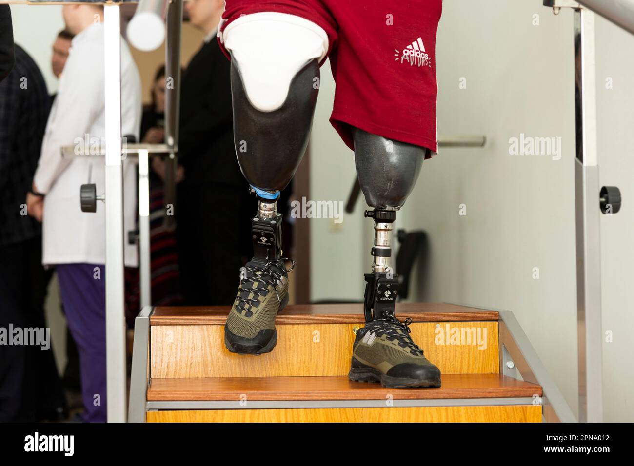 Lviv, Ukraine. 14 April, 2023. A wounded Ukrainian veteran practices walking on stairs with newly fit prosthetic limbs at the Halychyna Rehabilitation Center, April 14, 2023 in Lviv, Ukraine.  Credit: Ukraine Presidency/Ukrainian Presidential Press Office/Alamy Live News Stock Photo