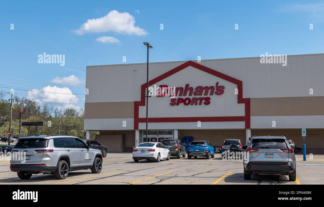 The Dunham's Sports store with cars parked in it's parking lot in