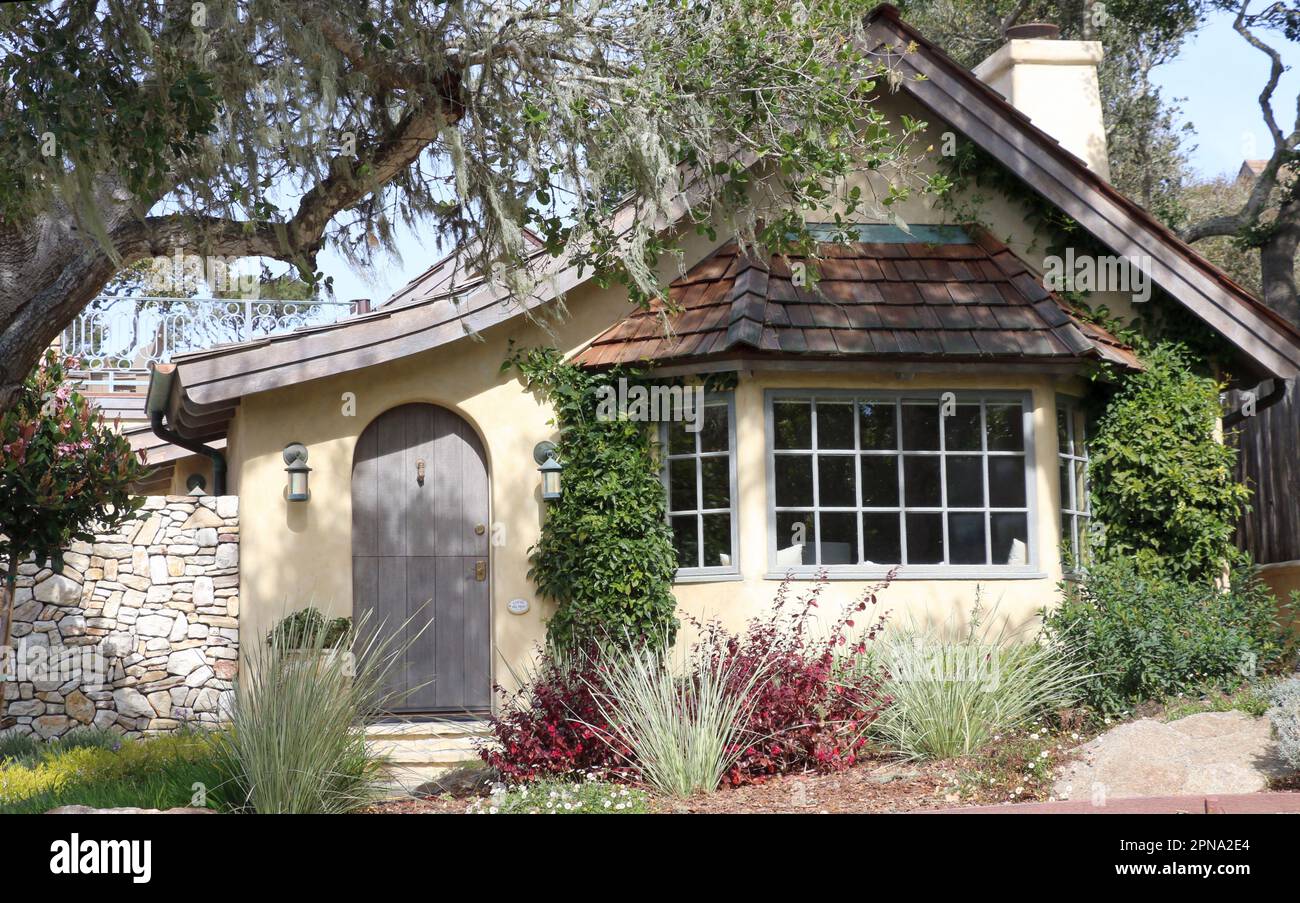 Charming storybook cottage with a bay window, constructed from wood and