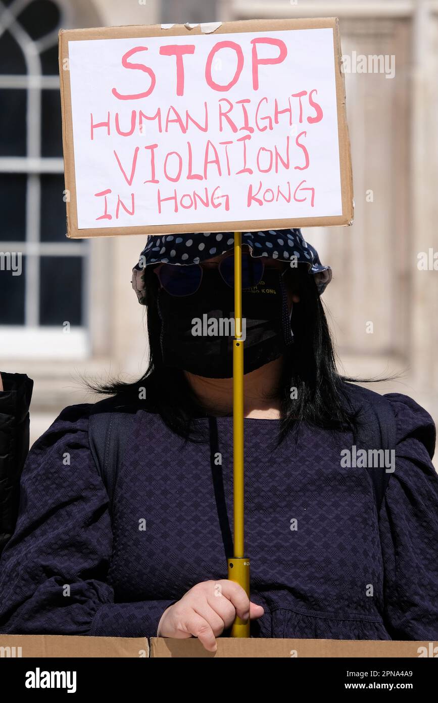 London, UK. Hongkongers stage a protest outside the Guildhall against the visit of minister Christopher Hui Ching-yu who is on an official visit. Stock Photo