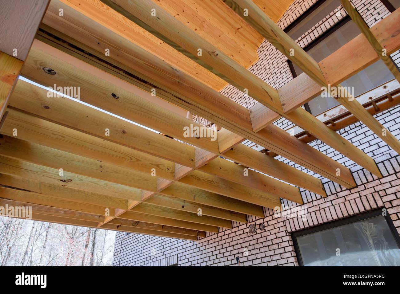 New constructed flooring joists layout for wooden deck patio at new