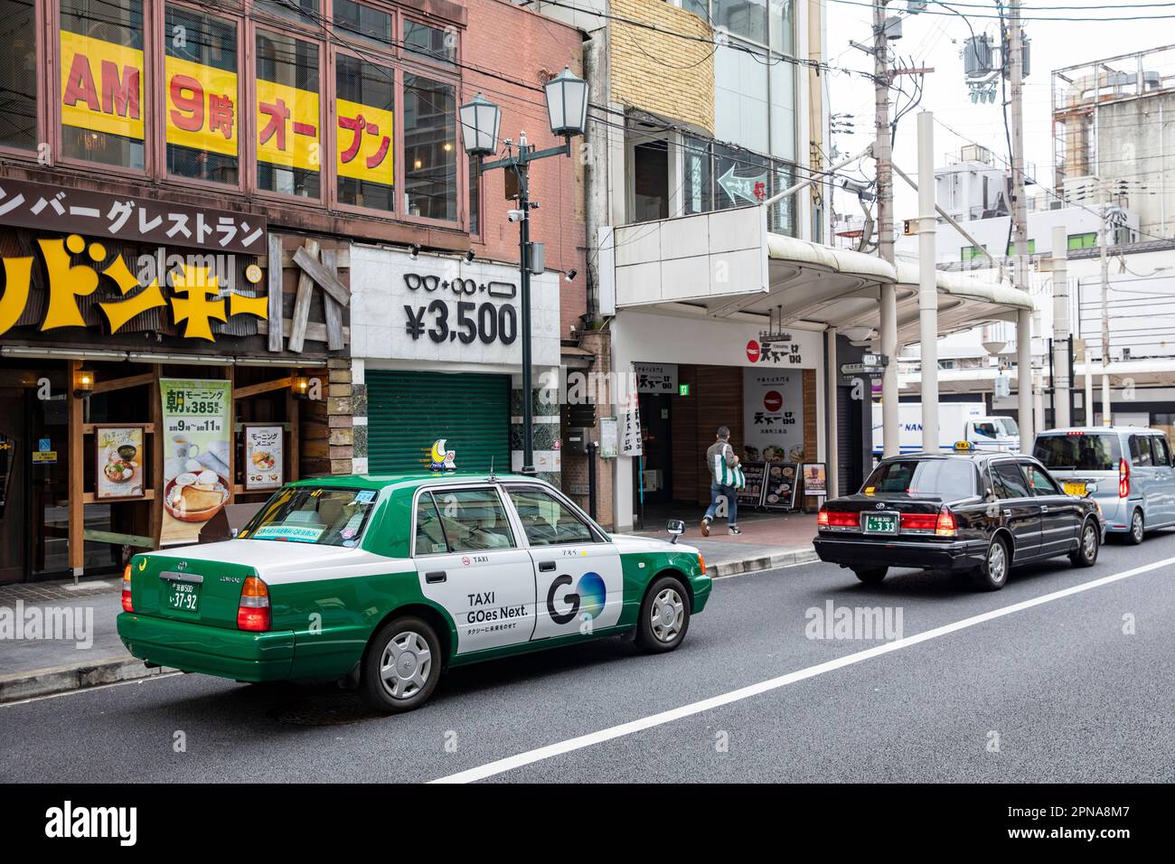 April 2023, traditional Japanese taxi a Toyota Crown four door saloon  vehicle on the streets of Kyoto city centre,Japan Stock Photo - Alamy