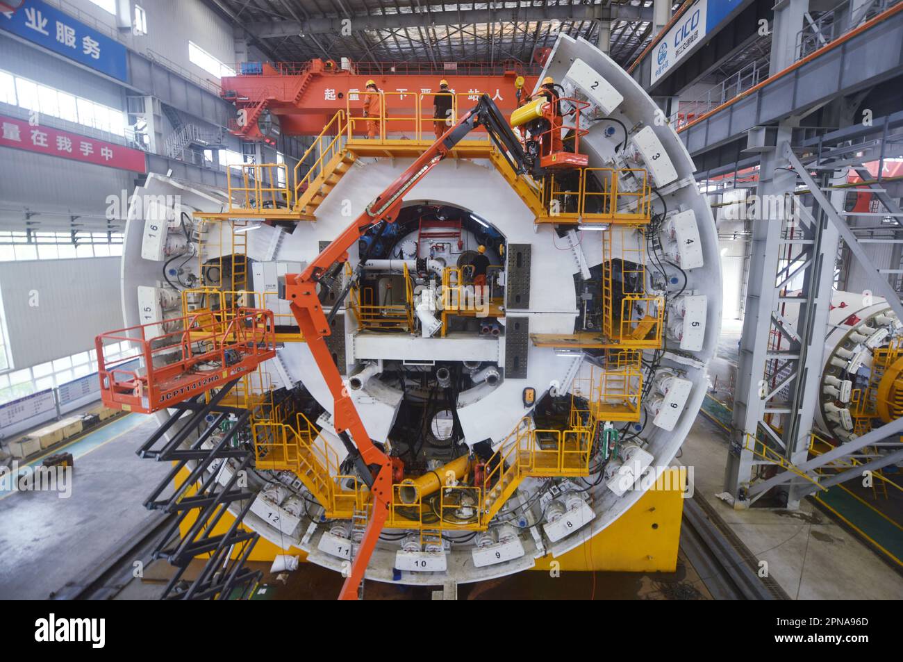 HANGZHOU, CHINA - APRIL 17, 2023 - Workers install parts of China ...