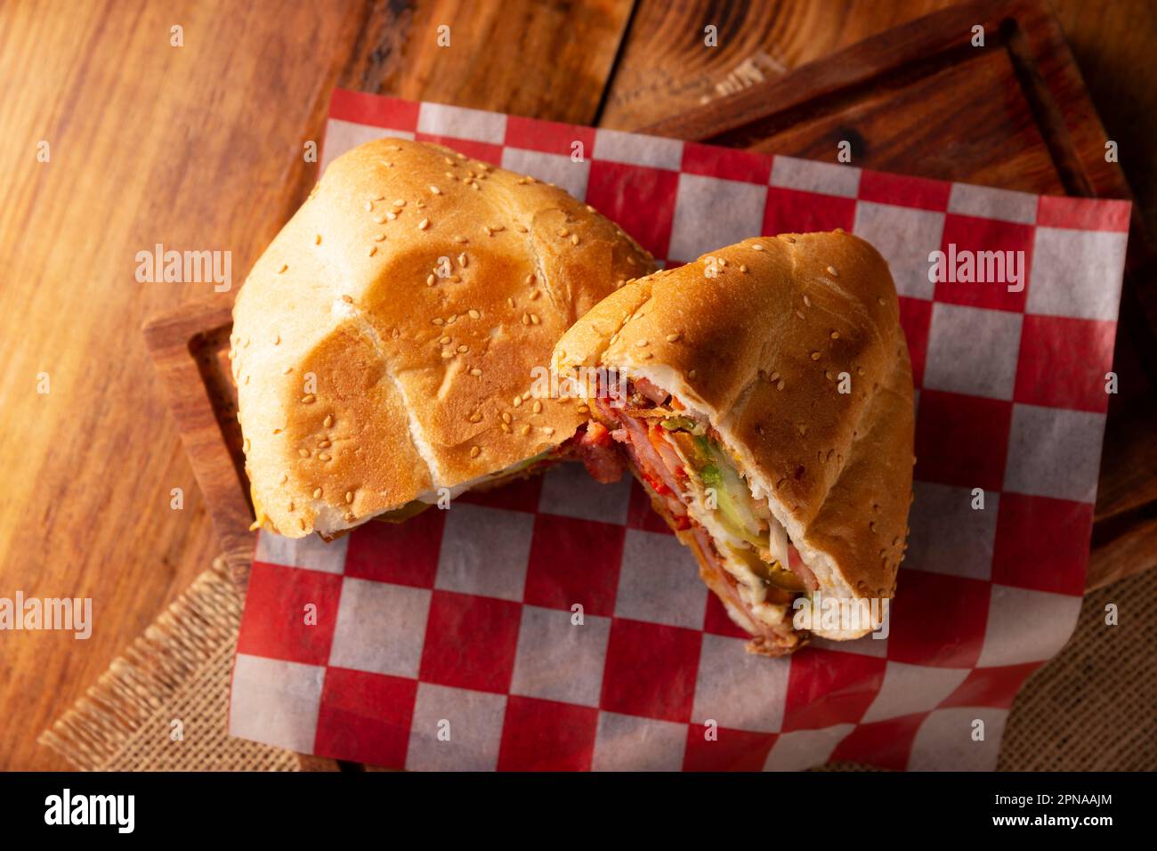 Mexican Torta. Sandwich made with common bread in Mexico, it can be telera, bolillo or bagette, split in half and filled with various ingredients, in Stock Photo