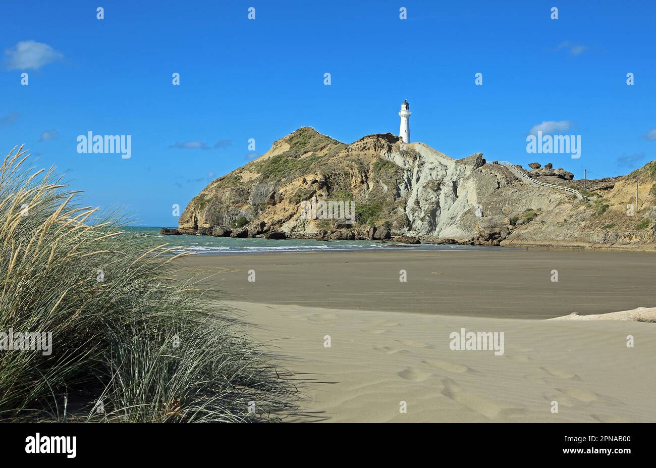 The dune and Castlepoint lighthouse - New Zealand Stock Photo