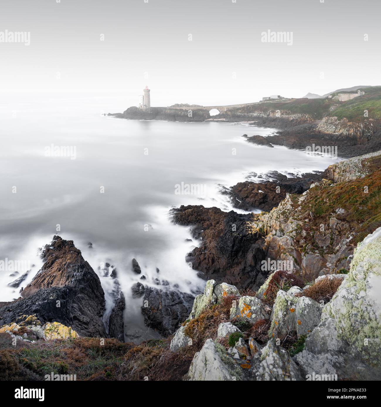 Long exposure of the Petit Minou lighthouse on the rugged coastline of ...