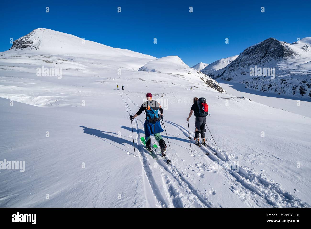 Skinning up towards the summit of Veslesmeden mountain in Rondane National Park, Norway Stock Photo