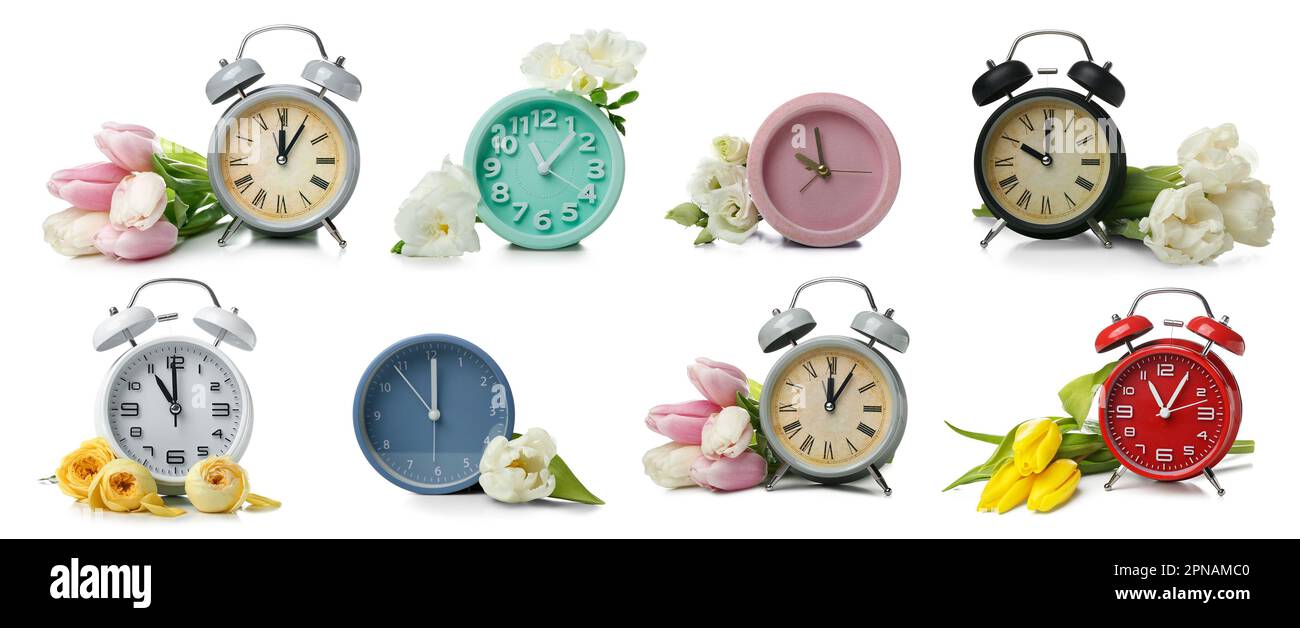 Set of many alarm clocks with beautiful flowers on white background