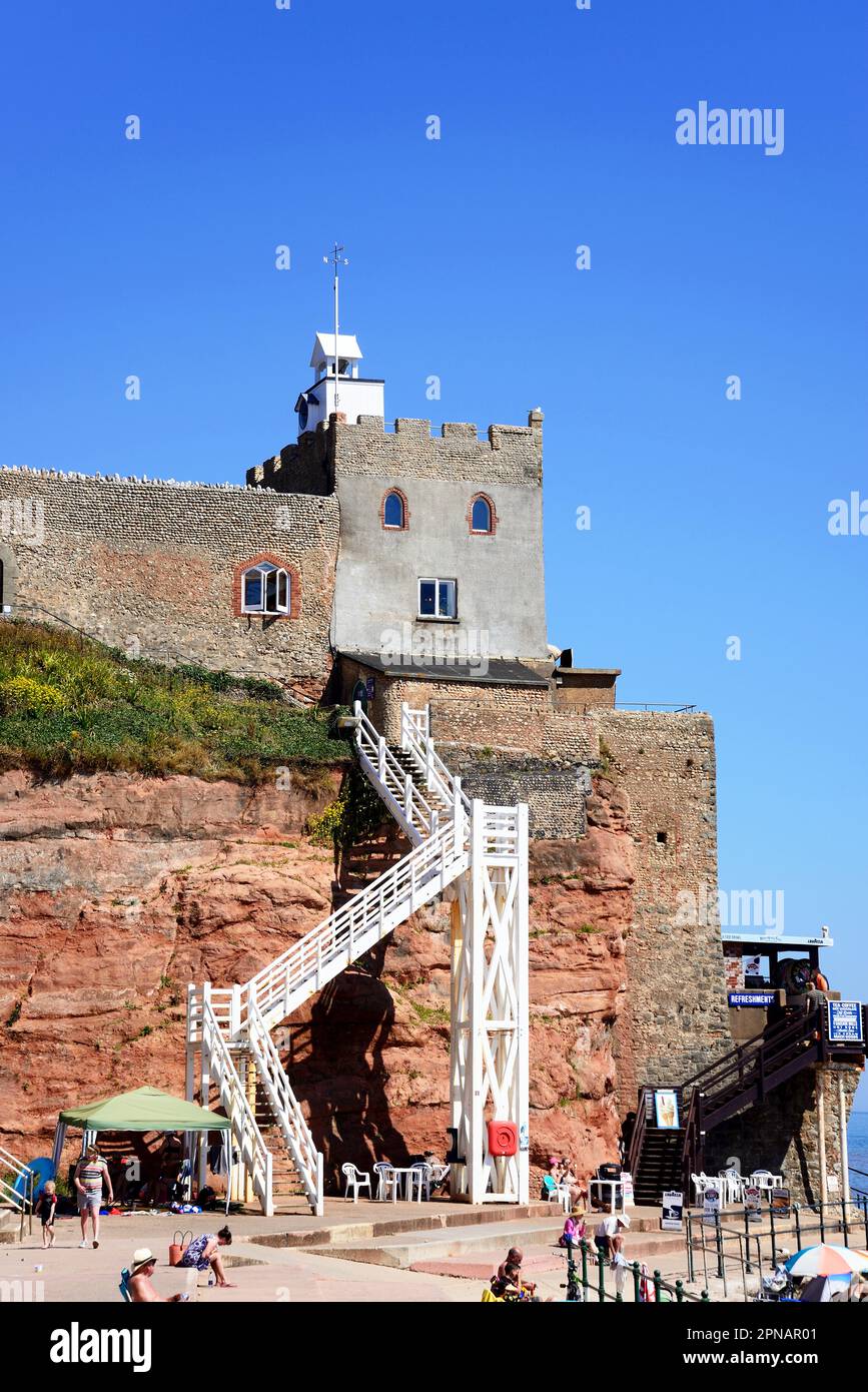 Tourists relaxing on Jacobs Ladder beach with the castle on the