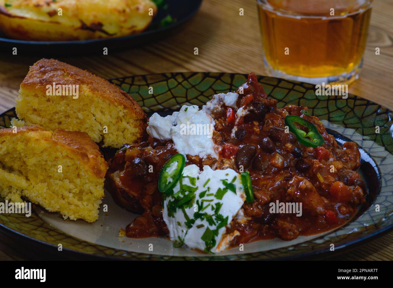 Black Bean Chili Con Carne in Bowl with Corn Bread Stock Photo Alamy