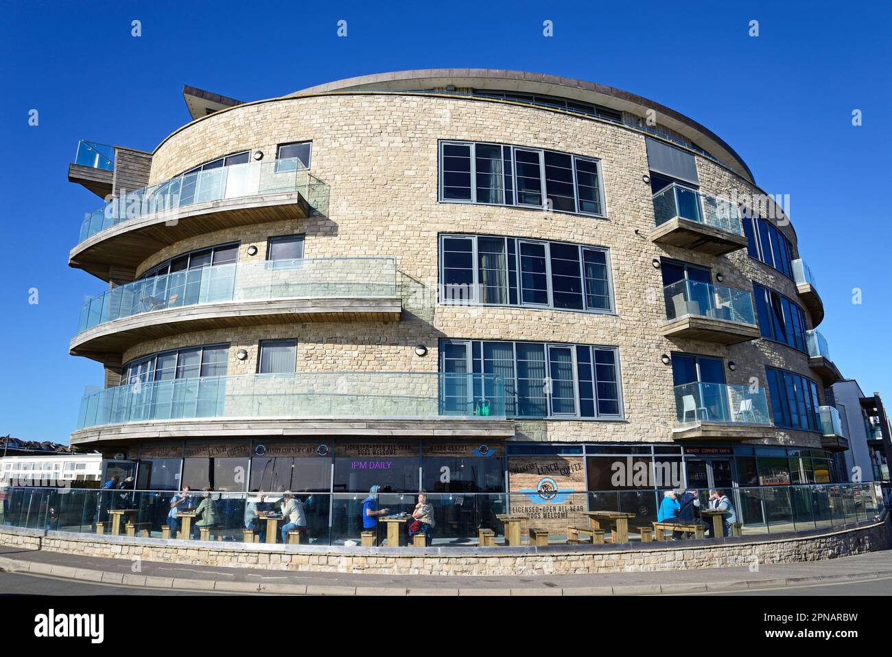 Tourists relaxing at the Windy Corner cafe in the Ellipse building on