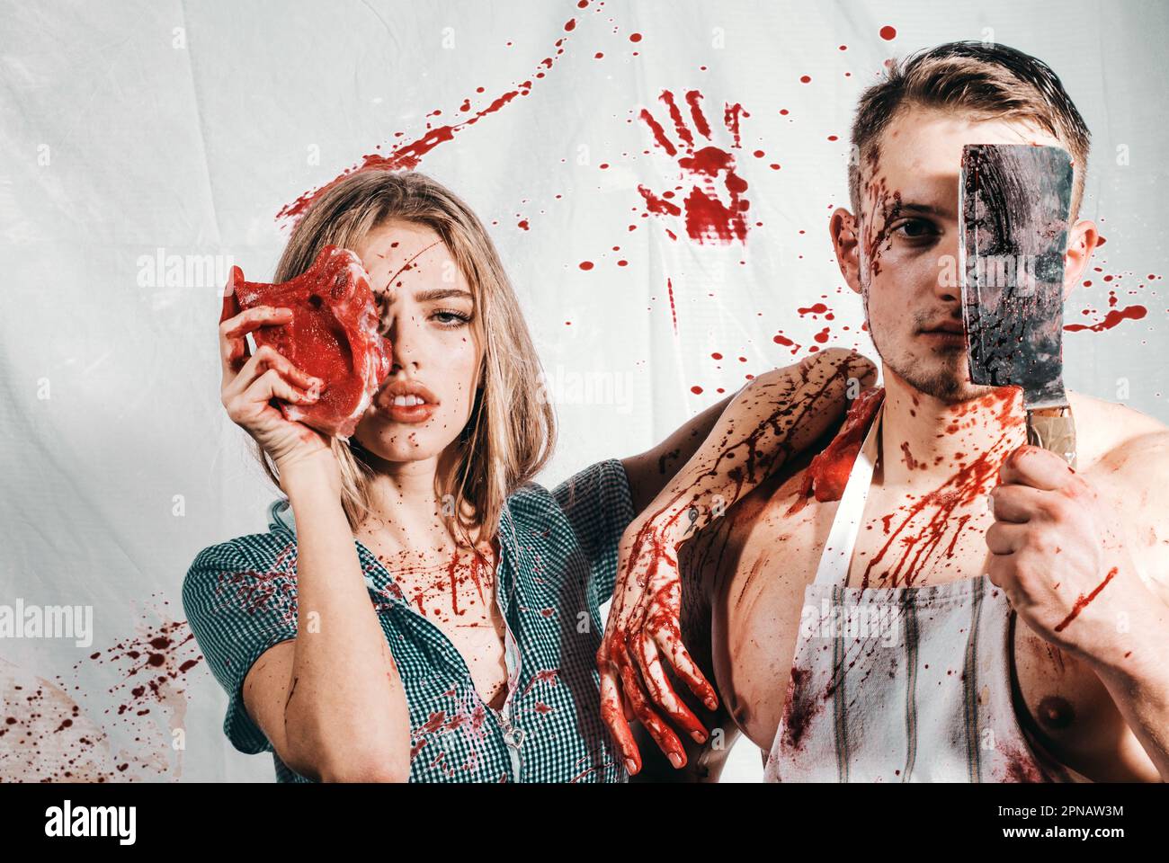 couple in blood. human internal organ trade. zombie. medical transplantation. cannibalism. donation and donar. meatman in butcher shop, butchery Stock Photo