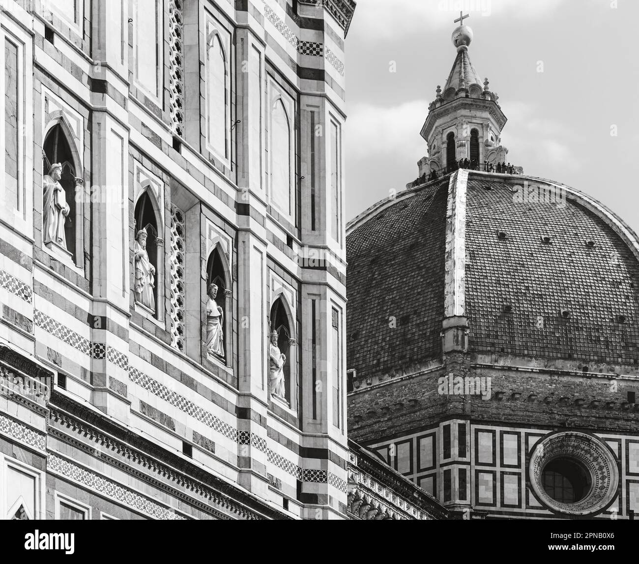 Filippo Brunelleschi's dome of the Duomo, or cathedral, seen beside part of the The Campanile or belltower. Florence, Tuscany, Italy.  The historic ce Stock Photo