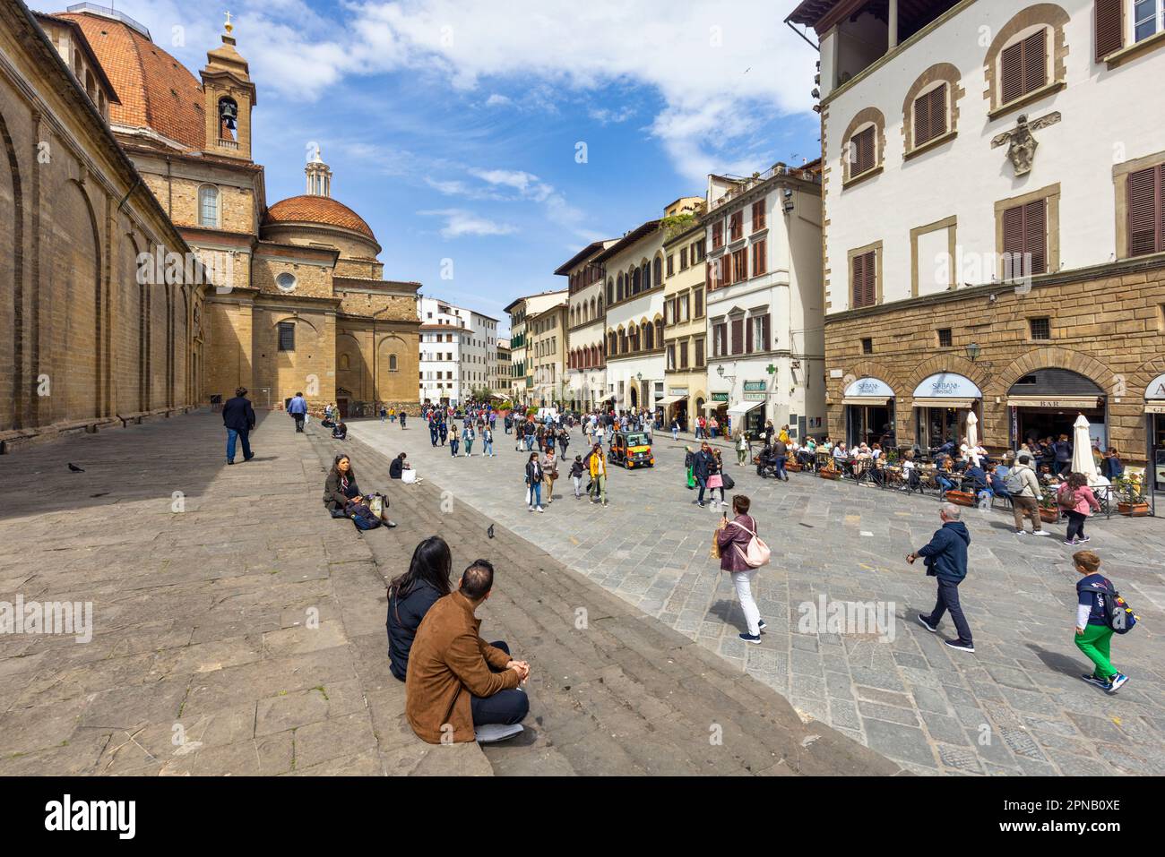 The Piazza di San Lorenzo.  The larger dome in the background belongs to the Cappelle Medicee, the Medici Chapels. Florence, Tuscany, Italy.  The hist Stock Photo