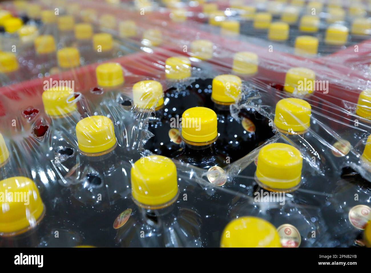 Glass bottles with yellow plastic cap with the traditional Vietnamese fish sauce Nuoc Mam. Phu Quoc. Vietnam. Stock Photo