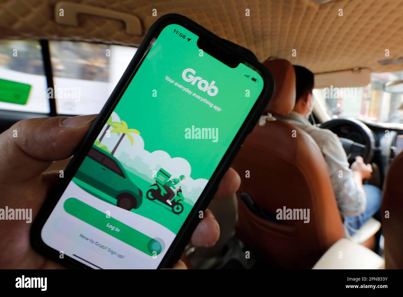 Taxi car Grab app on phone screen.  Ho Chi Minh City. Vietnam. Stock Photo