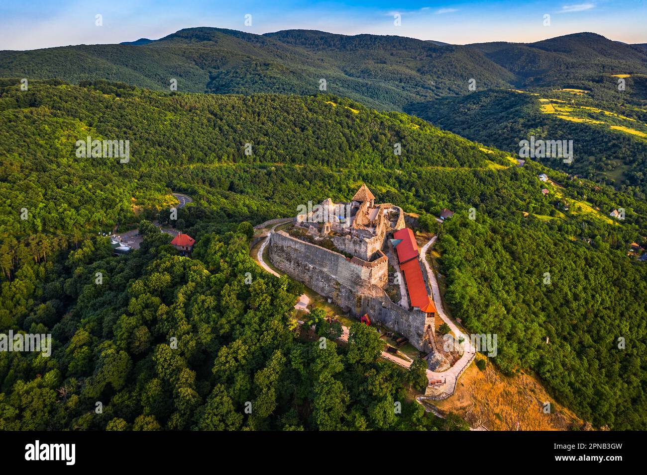 Visegrad, Hungary - Aerial panoramic view of the beautiful high castle of Visegrad with green foliage and trees and blue sky on a sunny summer day Stock Photo
