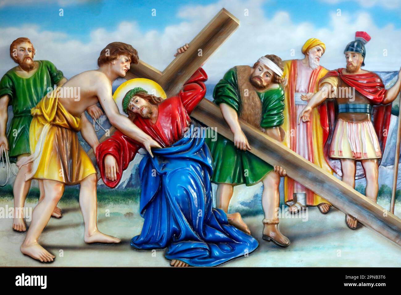 Fatima church.  Passion of Christ. Way of the cross. 5th Station: Simon of Cyrene helps Jesus to carry his cross. Ho Chi Minh City. Vietnam. Stock Photo