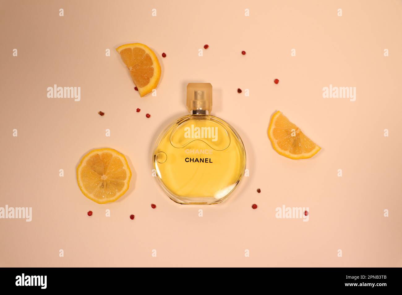 A Chanel perfume bottle with orange slices against a tan background Stock  Photo - Alamy