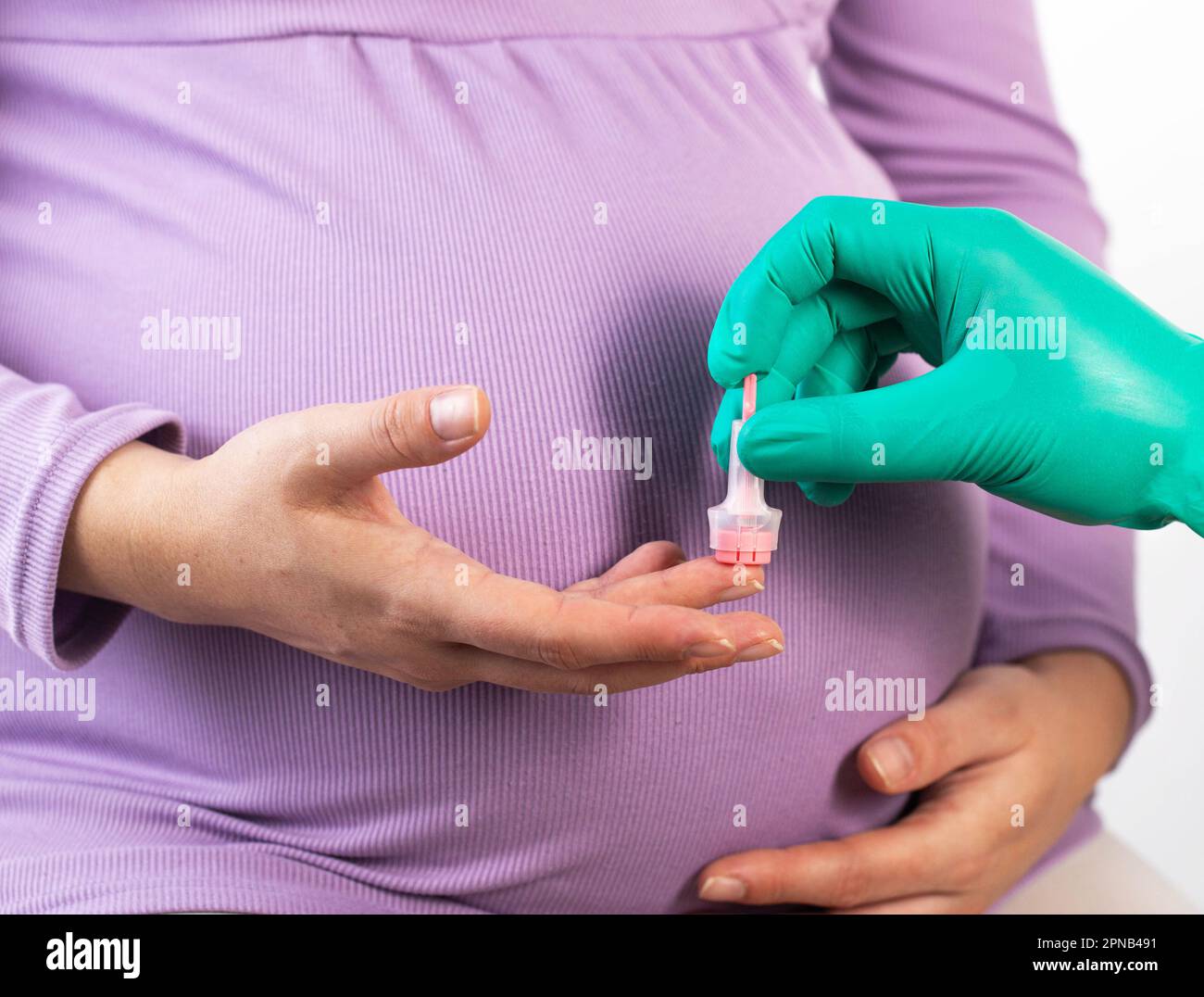 The doctor takes a complete blood count from the finger of a pregnant