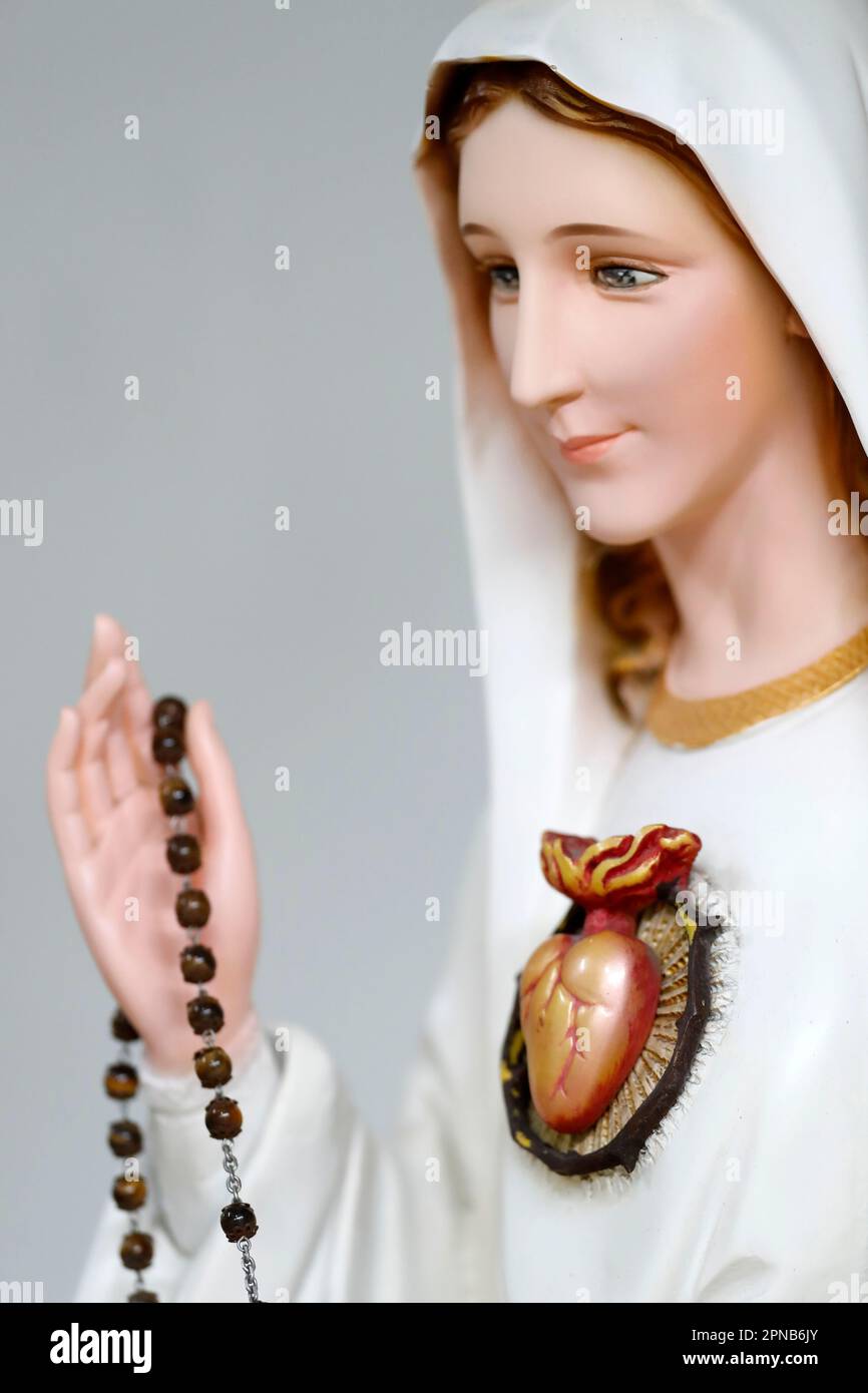 The Virgin Mary Praying the rosary. Statue.  Ho Chi Minh City. Vietnam. Stock Photo