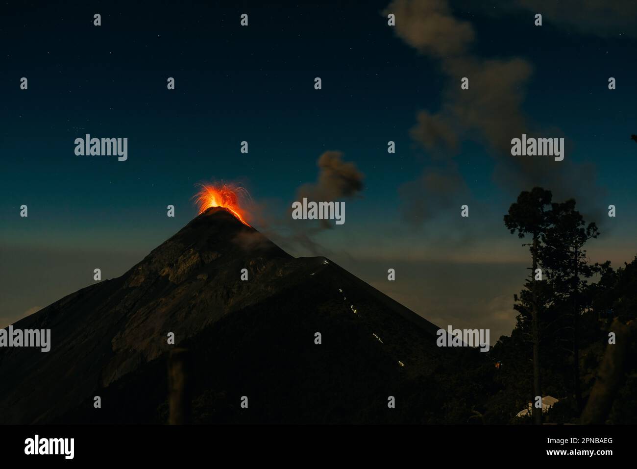 Volcano Fuego erupting at night from view of Volcano Acatenango ...