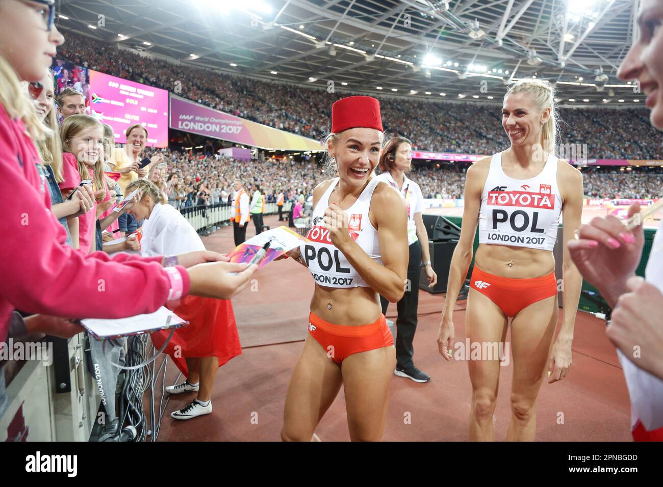 Members of the Polish girls' 4x400m relay with their country's flags at the World Athletics Championships in London 2017. Stock Photo