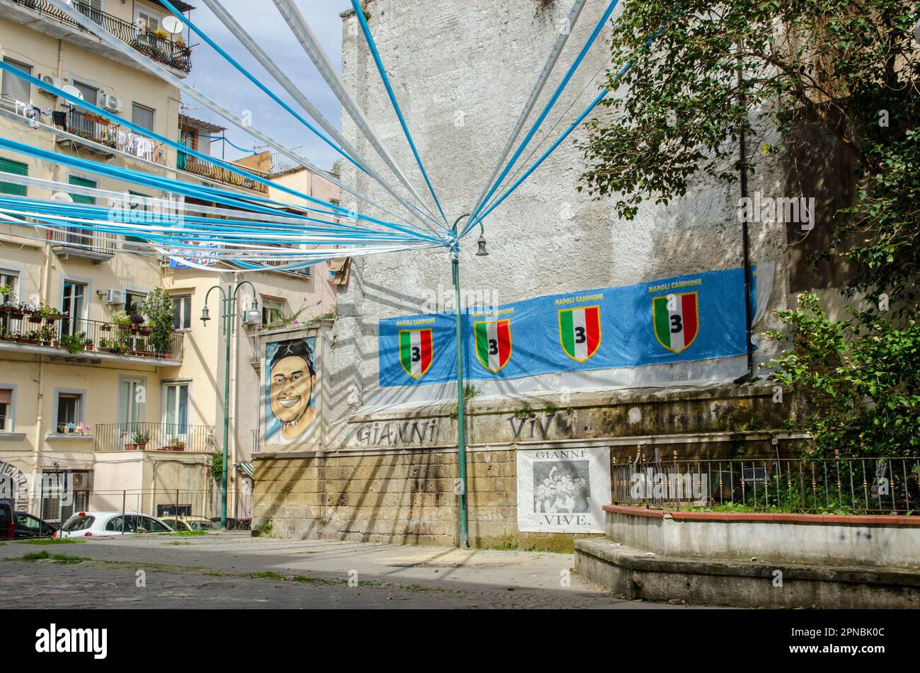 Naples, Italy - April 2, 2023:  A small piazza on Via San Giovanni in Porta in Central Naples festooned with bunting and flags celebrating the success Stock Photo