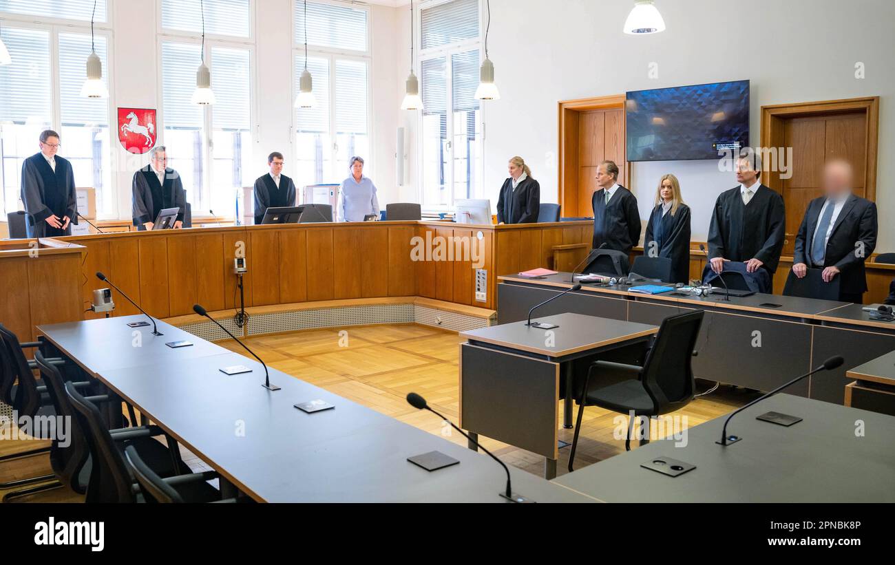 Oldenburg, Germany. 18th Apr, 2023. The accused trustee (r) stands with
