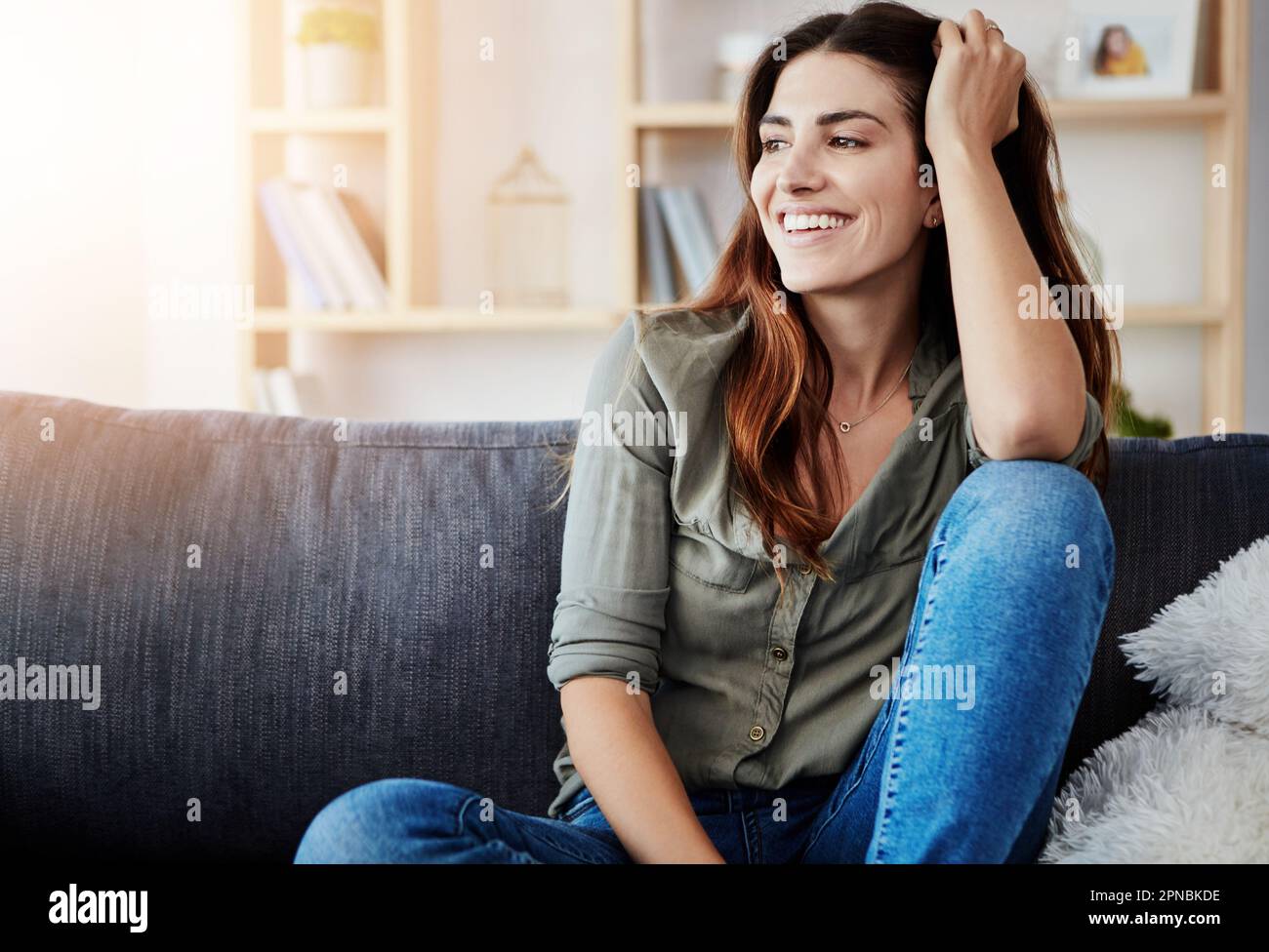 Relaxed in my own home. a beautiful young woman relaxing in the sofa at home. Stock Photo