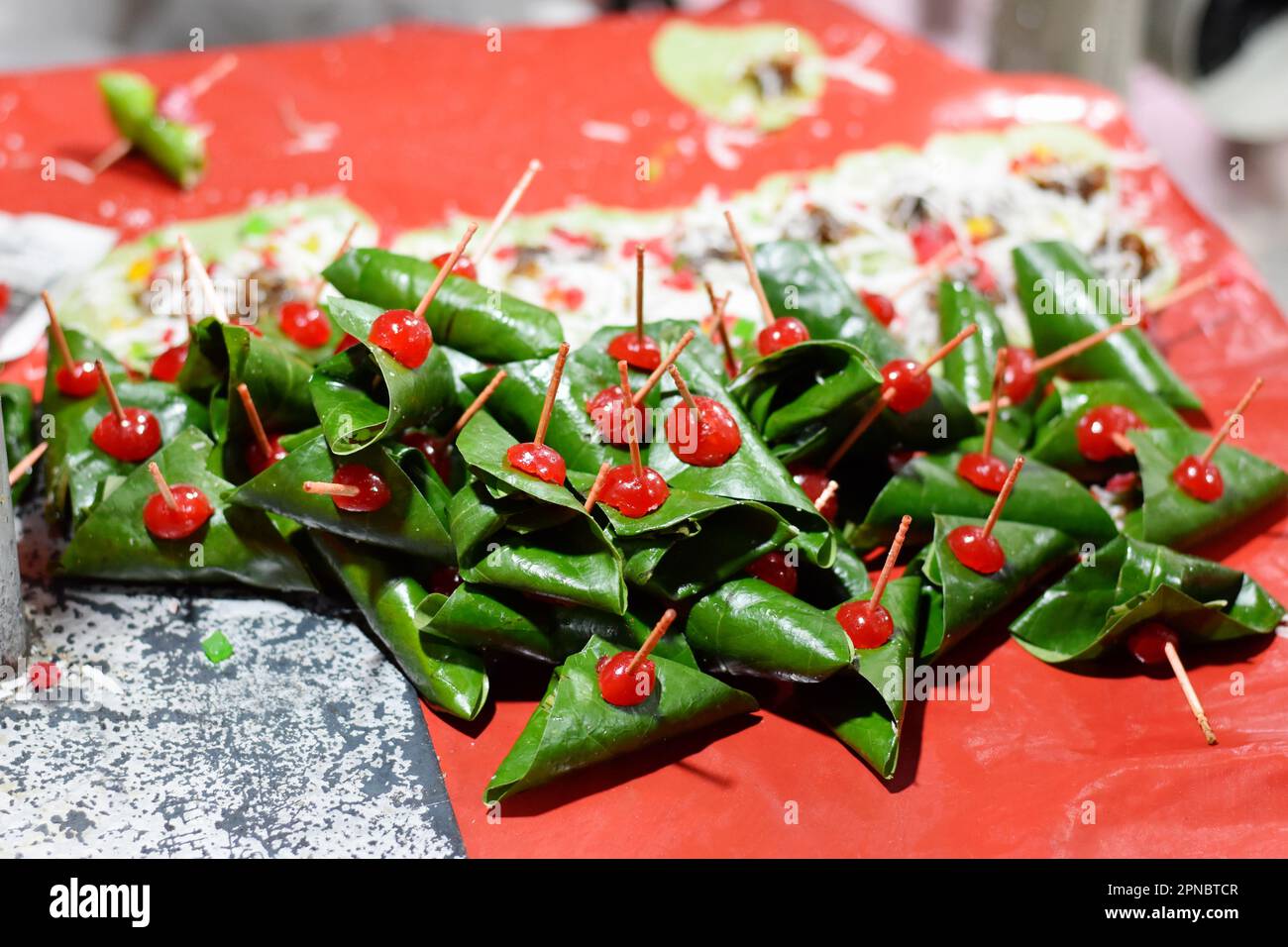 Masala Paan, Meetha Paan, or Beeda, Indian Traditional Mouth Freshener Sweet Paan wrapped in betel leaf, often used as an after dinner digestive, Pune Stock Photo