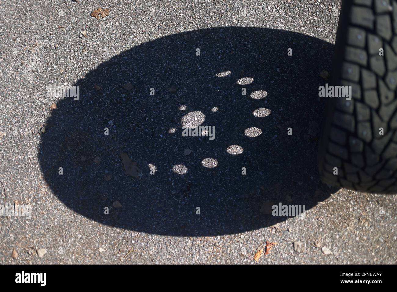 Someone changing wheels, from winter tires to summer tires Stock Photo
