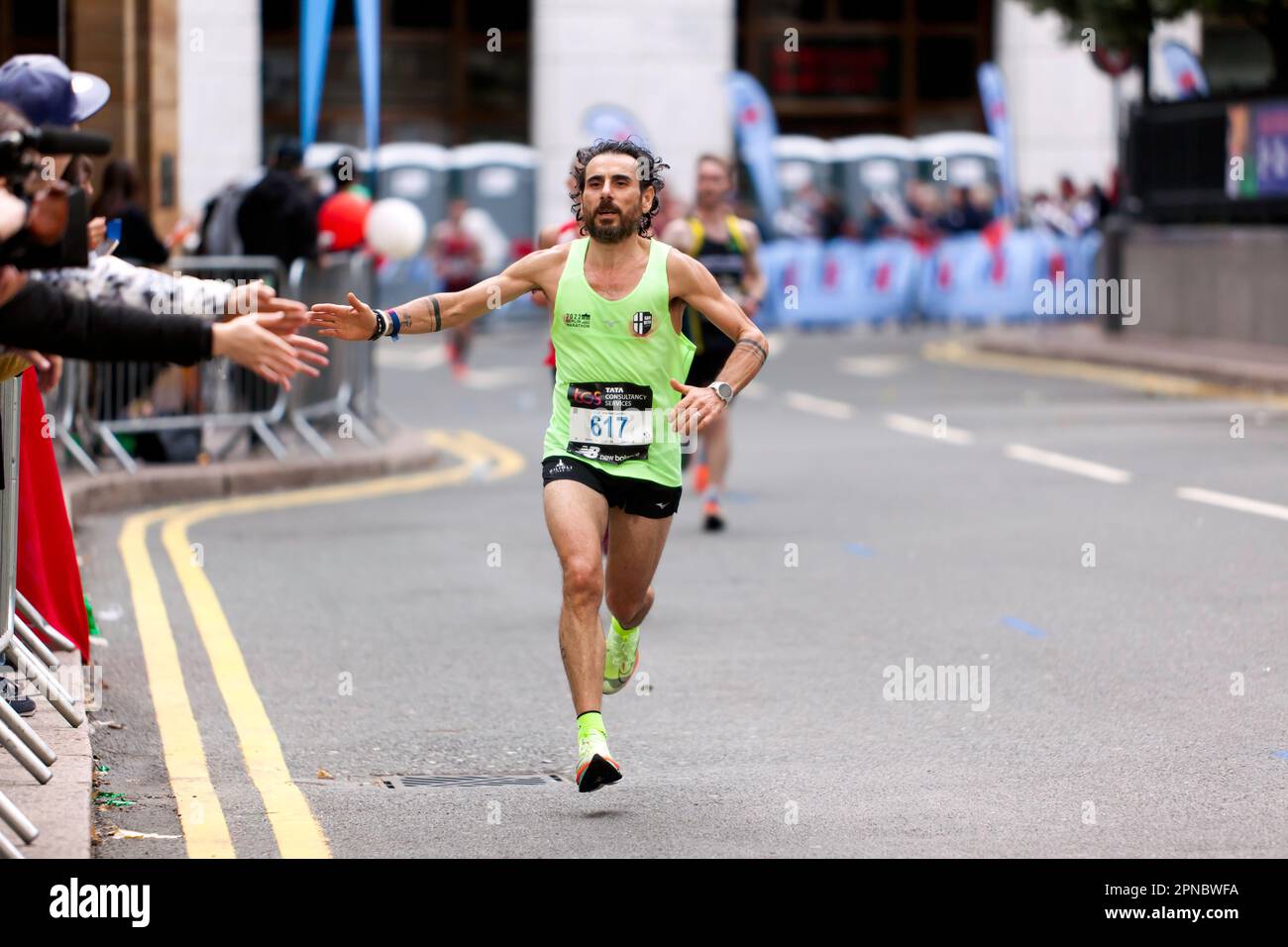 William Talleri, passing through Cabot Square on his way to finish 6th in the 45-49 Category of the 2022 London Marathon in 02:31:45 Stock Photo