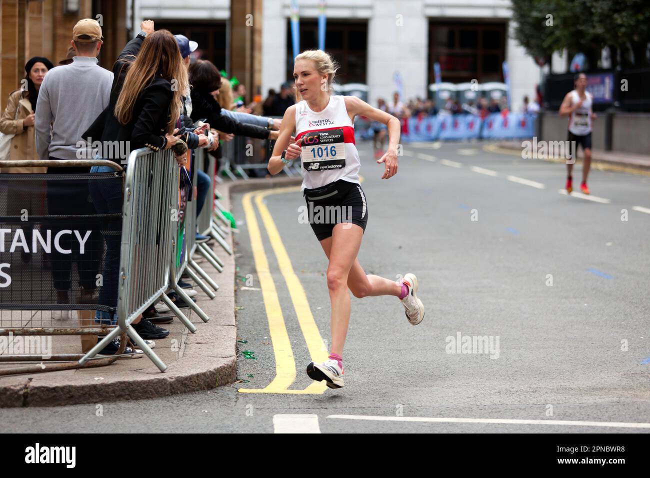 Hannah Alderson passing through Cabot Square on her way to finish 1st,  in the 18-39 Category of the 2022 London Marathon in 02:35:56 Stock Photo
