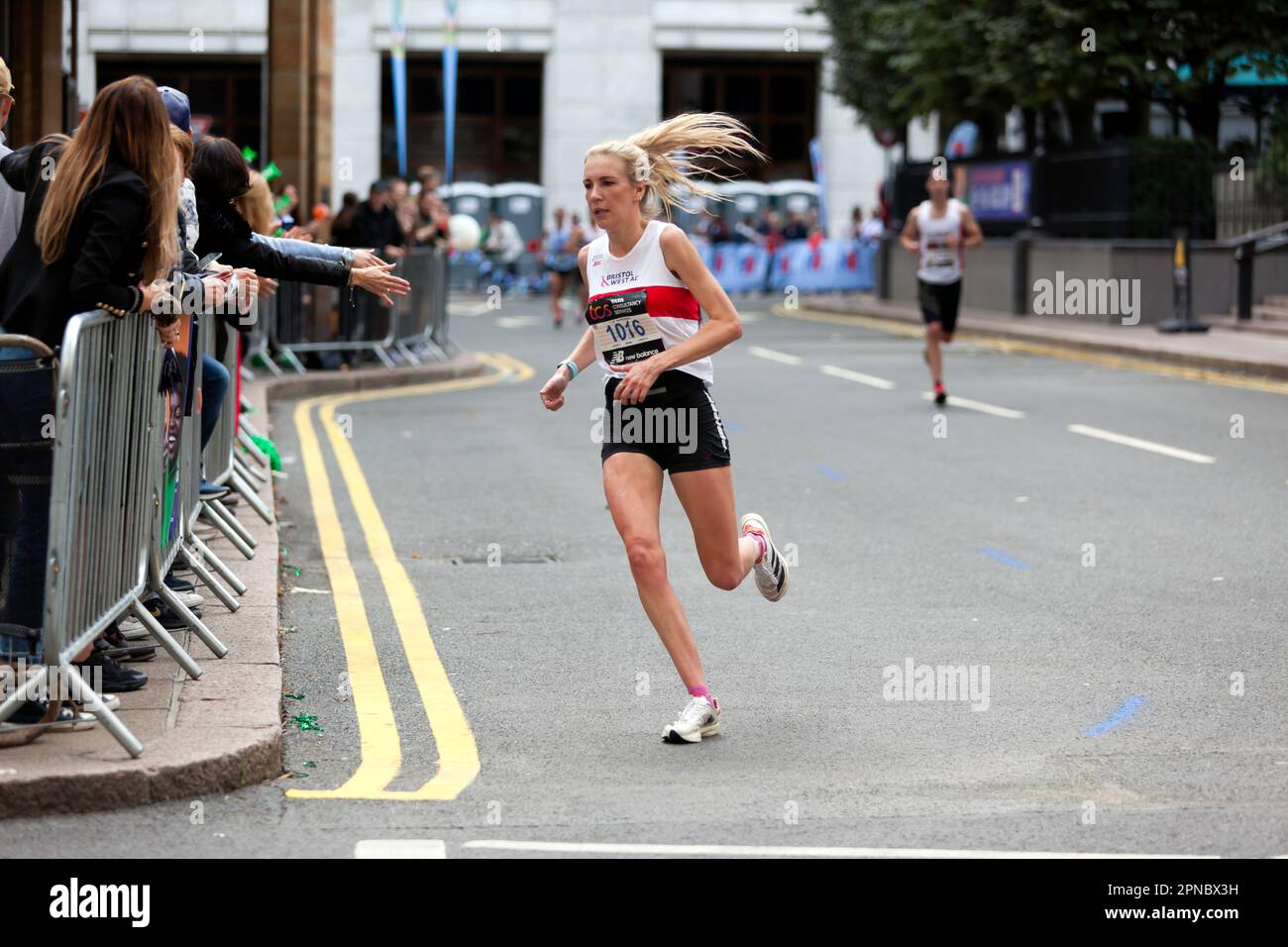 Hannah Alderson passing through Cabot Square on her way to finish 1st,  in the 18-39 Category of the 2022 London Marathon in 02:35:56 Stock Photo