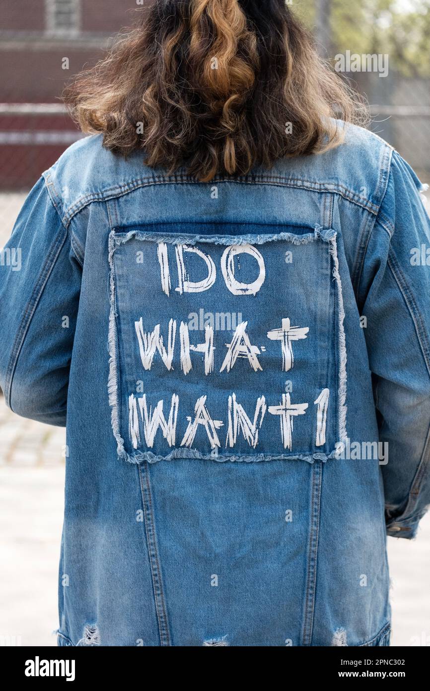 The back side of a woman's denim jacket proclaiming 'I Do What I Want.' In Williamsburg, Brooklyn, New York City. Stock Photo