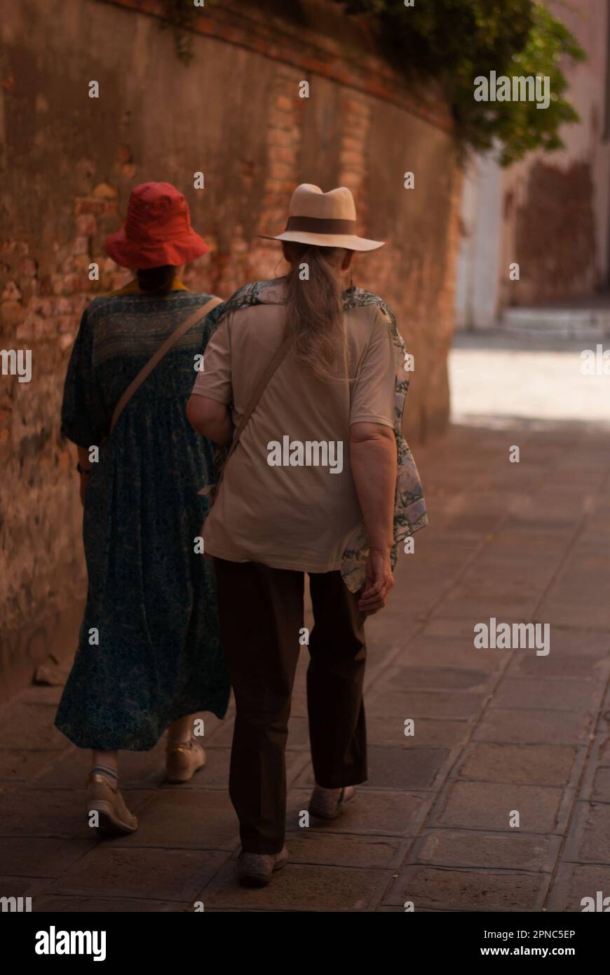 View on two stylish women on the street of old city Stock Photo