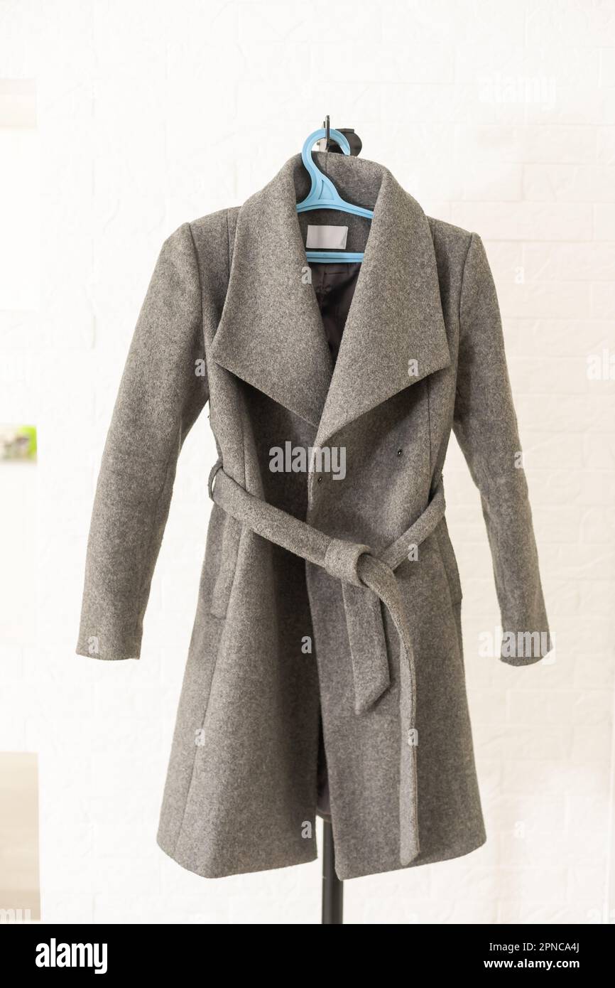 isolated women's long coat white background Stock Photo - Alamy