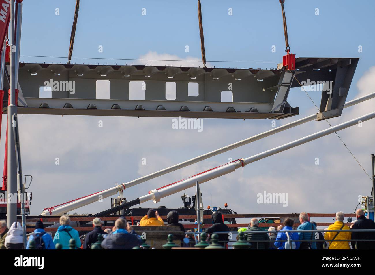 Magdeburg, Germany. 18th Apr, 2023. A crane lifts a 50ton bridge