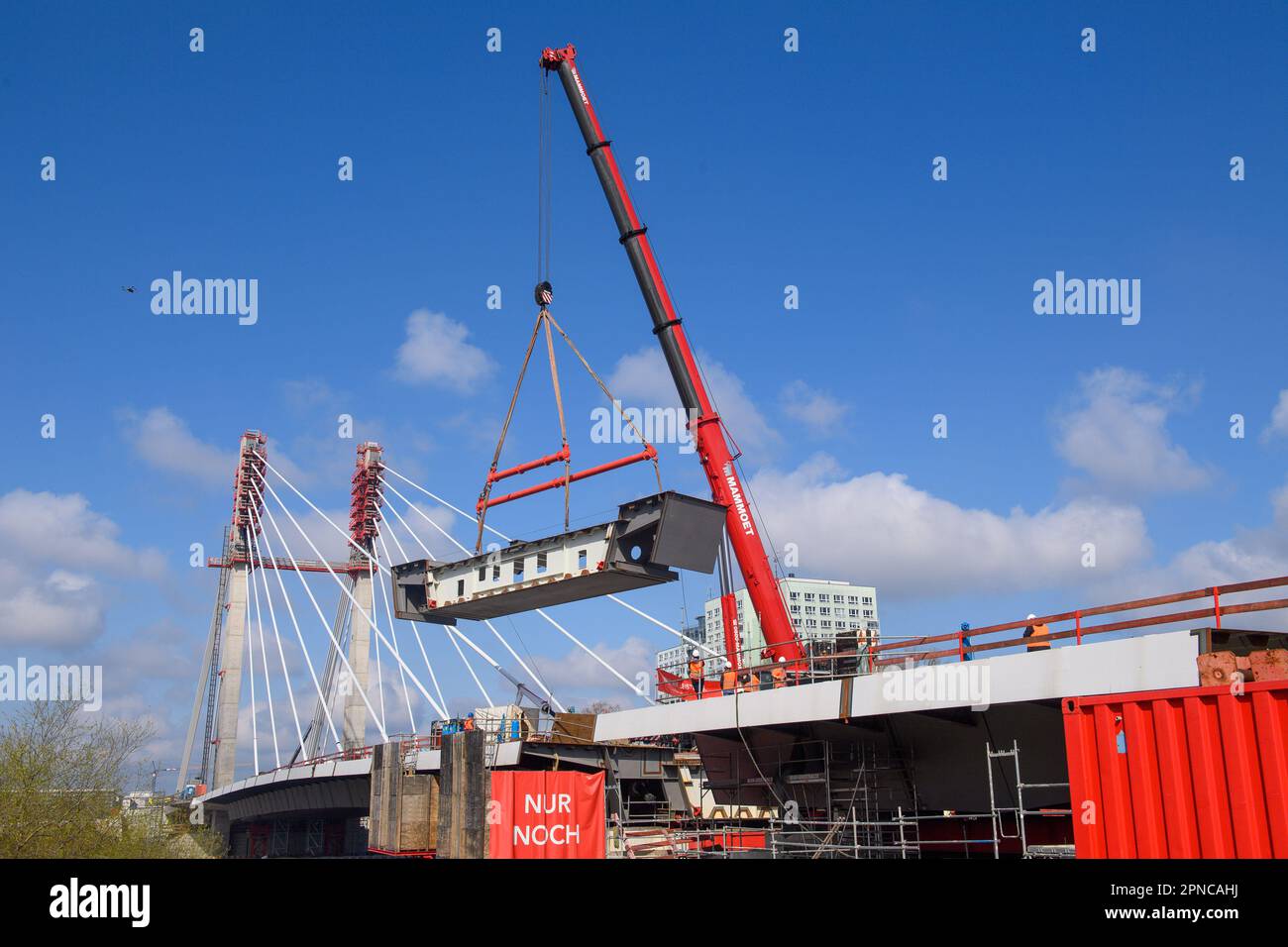 Magdeburg, Germany. 18th Apr, 2023. A crane lifts a 50ton bridge
