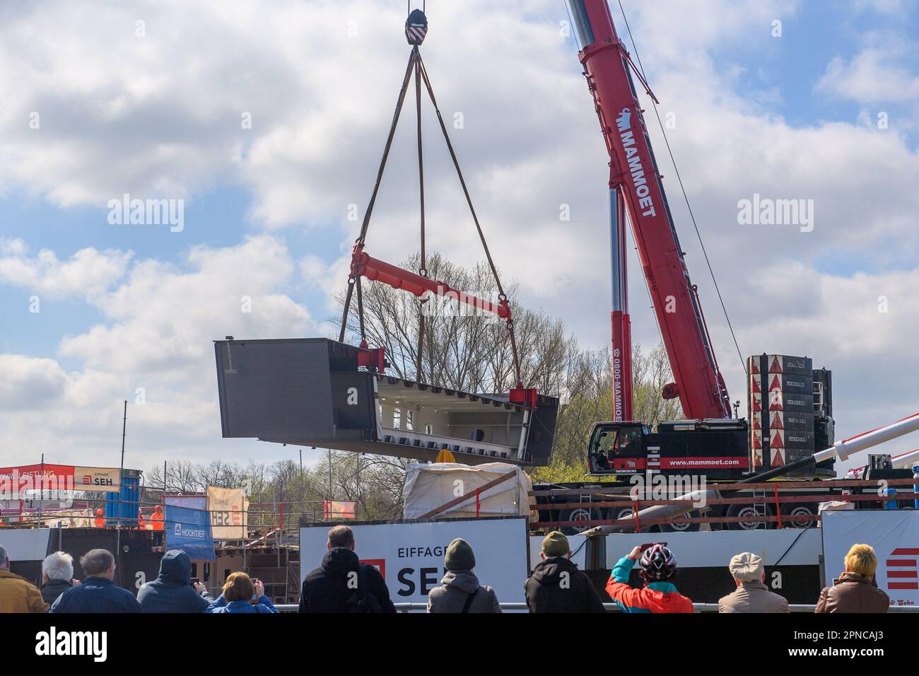 Magdeburg, Germany. 18th Apr, 2023. A crane lifts a 50ton bridge