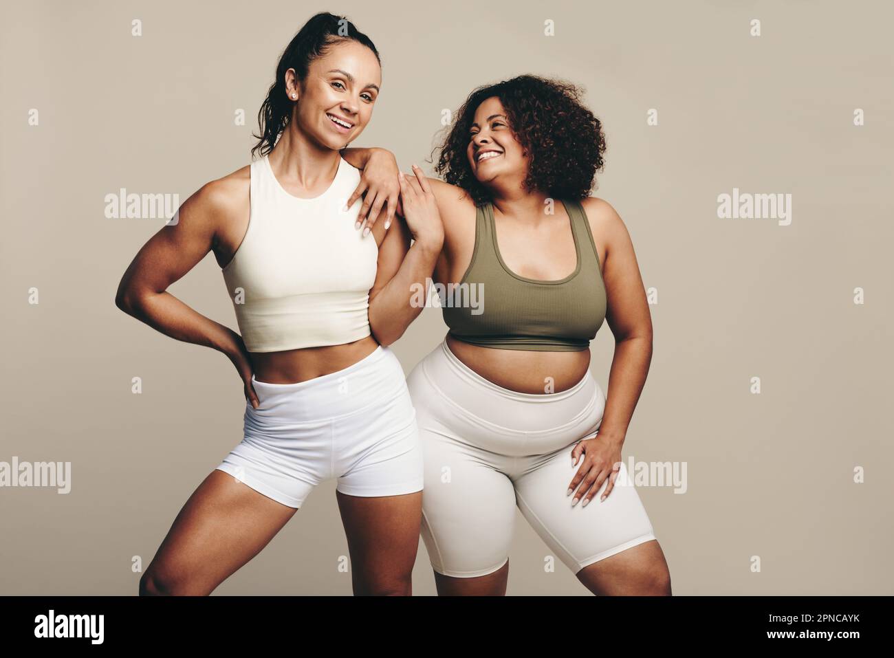 Sports women of different body types stand side by side, wearing