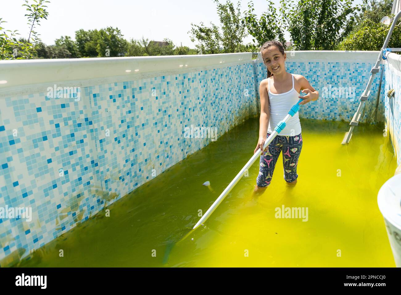 a little girl cleans a very dirty pool Stock Photo Alamy