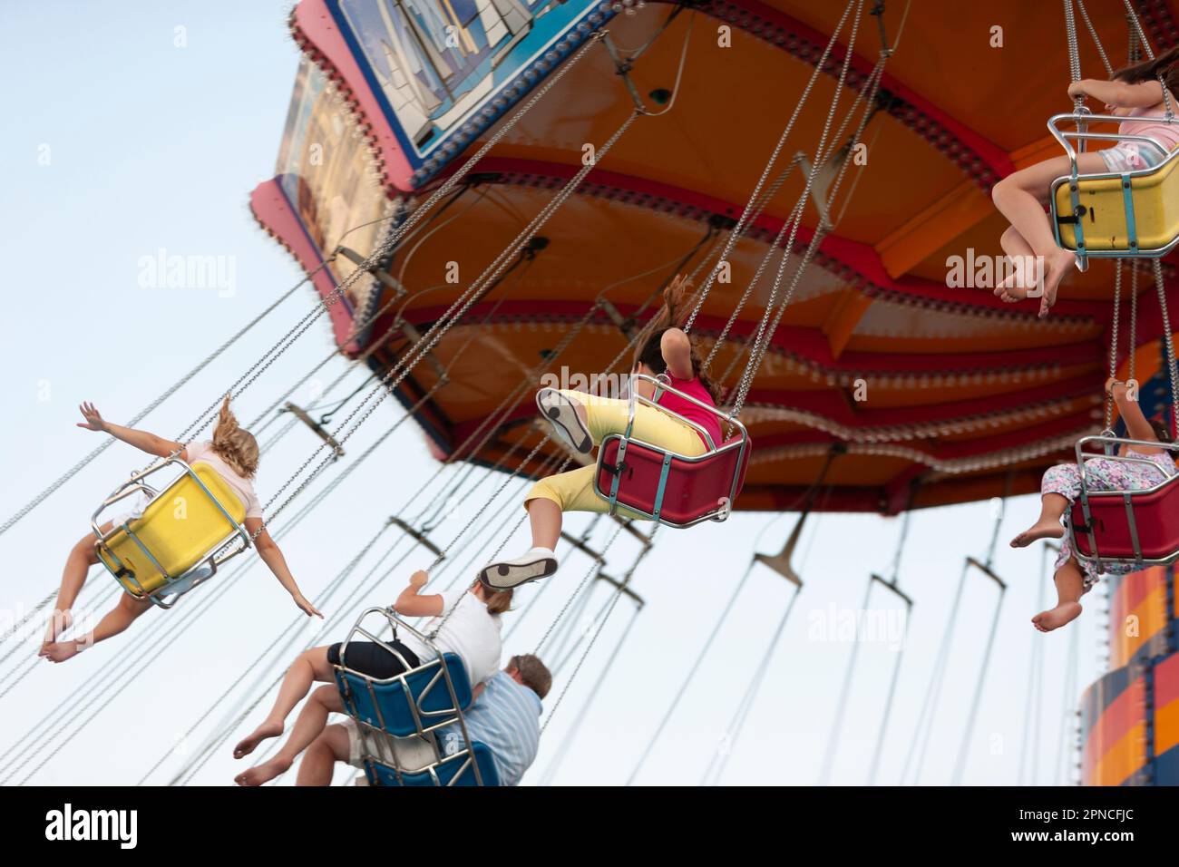 People riding the swinging chairs ride in an amusement park, Chicago