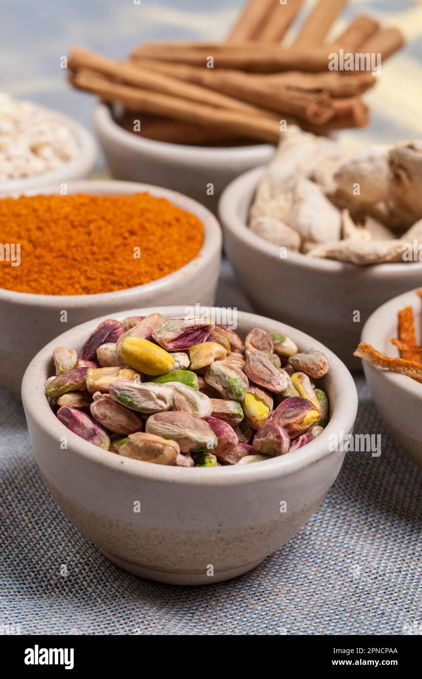Assorted seeds and flavors  on a grey cloth. Stock Photo
