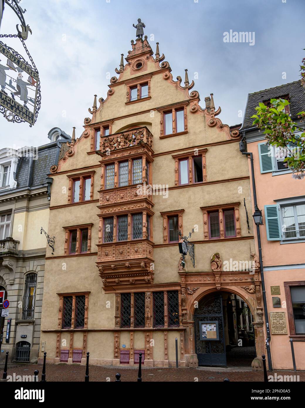 The House of 100 Faces in Colmar, France. The owner, a barrel maker, had the faces of 100 of his drinking friends carved into the stonework. Stock Photo