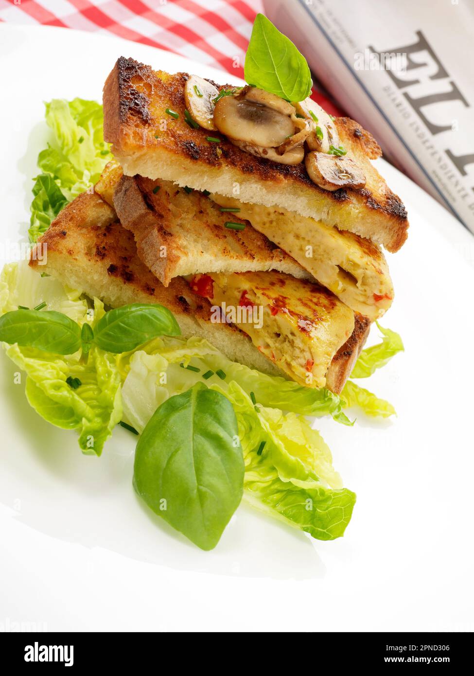 Spanish omelette sandwich with basil and mushrooms Stock Photo