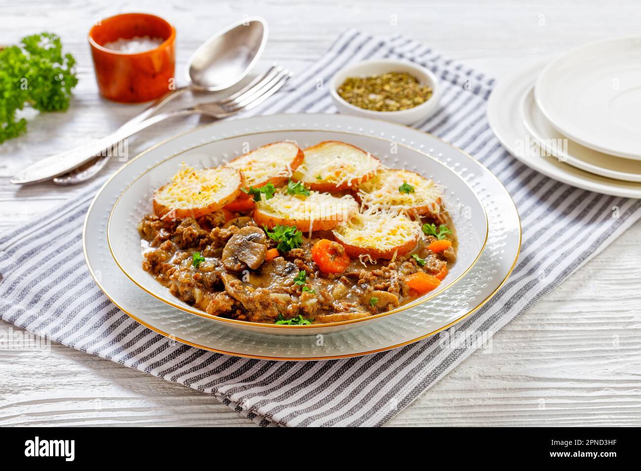 Ground Beef stew with mushrooms and carrots served with roasted