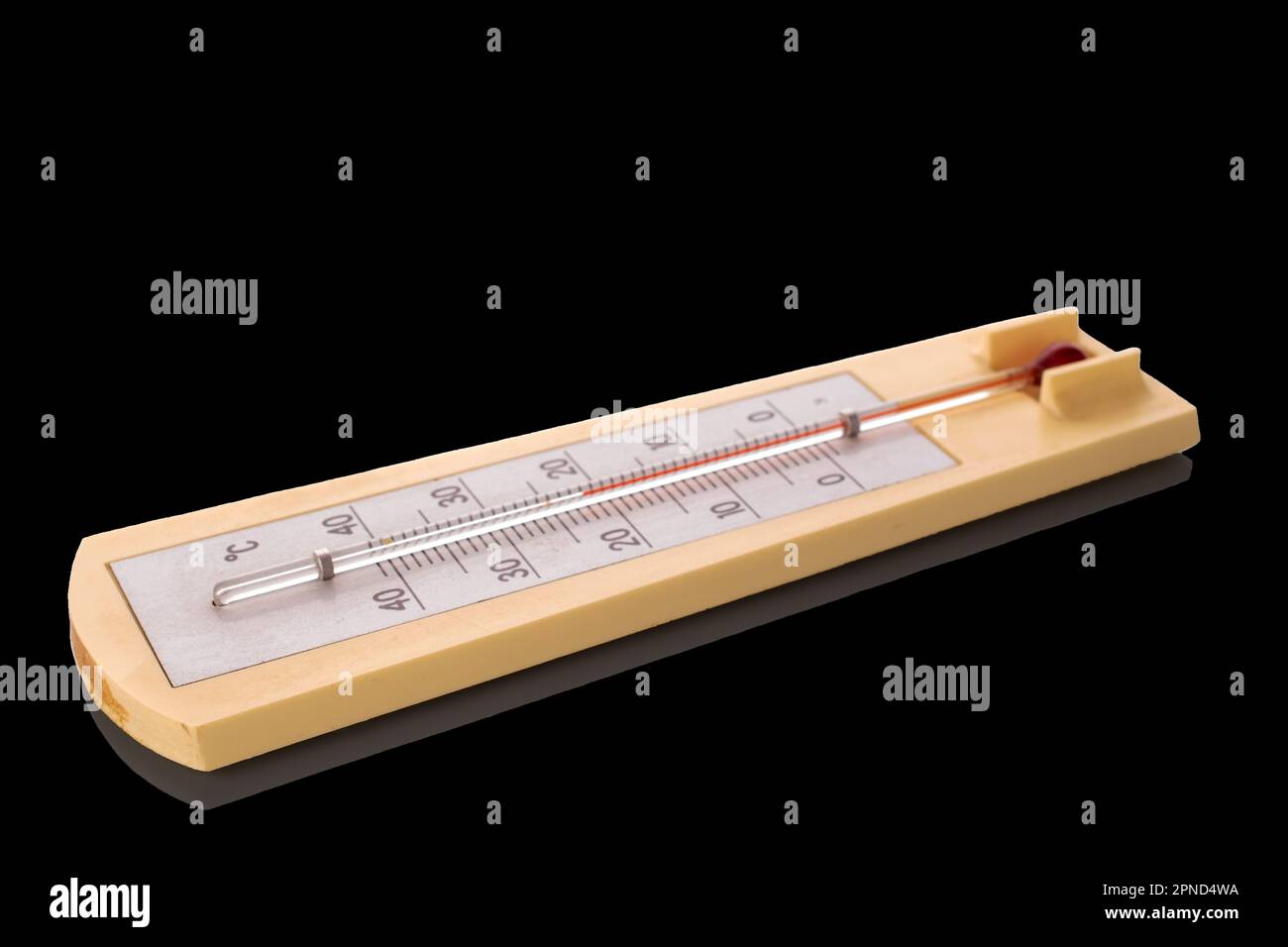 One thermometer for measuring room temperature, macro, isolated on black background Stock Photo