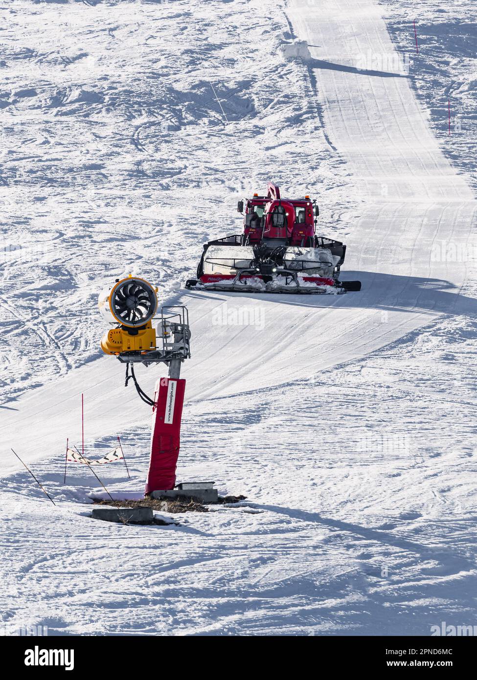 Huez, France 9 April 2023 Snowcat, ratrack PistenBully machine for snow preparation while